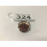 A HALLMARKED 9CT GOLD AND RUBY RING, ONE STONE MISSING, 3G