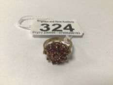 A HALLMARKED 9CT GOLD AND RUBY RING, ONE STONE MISSING, 3G