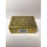 AN EMBOSSED BRASS CIGARETTE BOX
