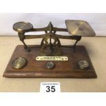 A SET OF VINTAGE POST OFFICE SCALES