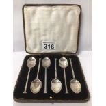 A SET OF SIX HALLMARKED SILVER SEAL END COFFEE SPOONS, CASED, 42G