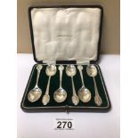 A CASED SET OF SIX HALLMARKED SILVER TEASPOONS WITH GOLFING TERMINALS, 102 GRAMS BY COOPER BROS