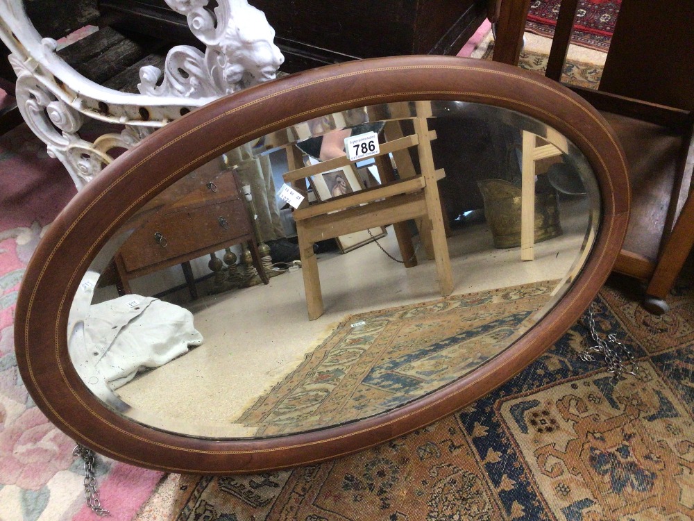 A VINTAGE CARVED WOODEN FRAMED MIRROR, 38 X 61CM