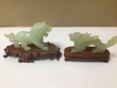 TWO CARVED JADEITE ANIMALS ON STANDS