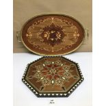 TWO MARQUETRY INLAID WOODEN SERVING TRAYS ONE IN OCTAGONAL FORM AND THE OTHER IN OVAL FORM, THE