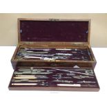 A VICTORIAN MAHOGANY CASED THREE TIER DRAWING INSTRUMENT SET