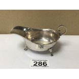 A HALLMARKED SILVER SAUCEBOAT ON PAD FEET 1921 BY BARKER BROS, 67 GRAMS, 12CM