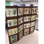 A VINTAGE WOODEN FOUR FOLD SCREEN DECORATED WITH VICTORIAN FLOWER PRINTS/ AND VICTORIAN DRESSWEAR