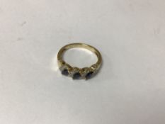A 375 9CT GOLD RING WITH DIAMONDS AND SAPPHIRES O SIZE