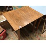 A VINTAGE TABLE ON CASTORS, 79 X 61CM