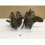 A PAIR OF METAL FIGHTING ROOSTERS LARGEST BEING 28CM IN HEIGHT