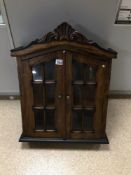 A SMALL WOODEN CABINET WITH GLASS FRONT DOORS, 64 X 50 X 15CM