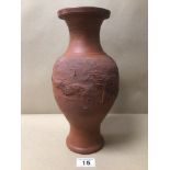 A TERRACOTTA RED CLAY VASE DECORATED WITH A CHINESE DRAGON 31CM IN HEIGHT