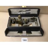 A SMALL VINTAGE LADIES TRAVEL VANITY CASE WITH BOTTLES, BRUSHES AND MORE