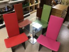 A MODERN GLASS DINING TABLE WITH FOUR DIFFERENT COLOURED CHAIRS (SIMON GAVINA STYLE) 80 X 80CM