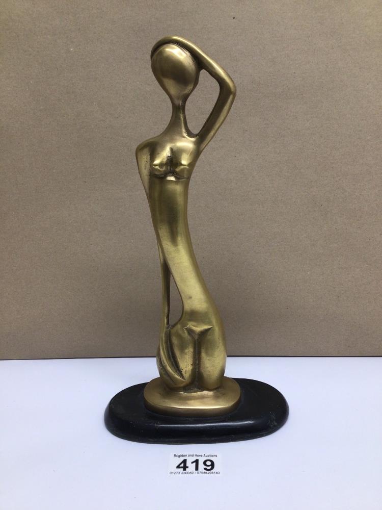 A VINTAGE BRASS STYLISED FEMALE NUDE ON WOODEN BASE, 29CM