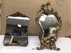 AN ART NOUVEAU BRASS MERCURY TABLE MIRROR DECORATED WITH A CHERUB, WITH ONE OTHER MIRROR