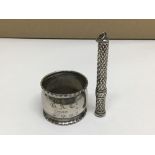A HALLMARKED SILVER NAPKIN RING WITH A HALLMARKED SILVER PART OF A PENCIL, 29 GRAMS