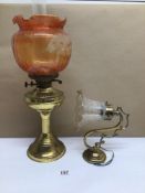 A VINTAGE BRASS OIL LAMP WITH AN ELECTRIC WALL LAMP, LARGEST BEING 56CM IN HEIGHT