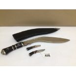 A KUKRI KNIFE WITH LEATHER SHEAF DECORATION ON BLADE WITH WHITE METAL ON HANDLE