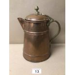 AN ARTS AND CRAFTS BRASS AND COPPER LIDDED PITCHER 27CM IN HEIGHT