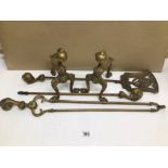 A VINTAGE BRASS BALL AND CLAW MOTIF FIRE COMPANION SET WITH A PAIR OF FIREDOGS TO MATCH