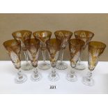 FIVE AMBER FLUTE AND FOUR AMBER WINE CUT GLASSES