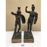 A PAIR OF BRONZED SPELTER SCULPTURES OF HALF-NUDE SOLDIERS ON MARBLE BASE A/F, LARGEST BEING 35CM IN