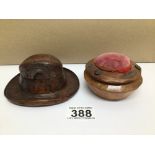 TWO EARLY WOODEN ITEMS A CARVED HAT (INKWELL) WITH A CARVED PIN CUSHION