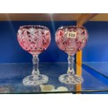 A PAIR OF BOHEMIAN ART GLASS CRANBERRY BOWLS ON STANDS, 27 X 17CM