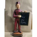 A STATUE OF A BELL BOY WITH A CHALK MESSAGE BOARD, 61CM