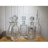 FIVE HEAVY CUT GLASS DECANTERS