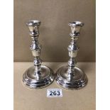 A PAIR OF WEIGHTED HALLMARKED SILVER BALUSTER SHAPED CANDLESTICKS, 17CM BY LAURENCE WATSON 1978,