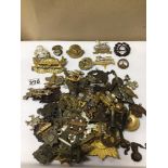 A COLLECTION OF MILITARY CAP & OTHER BADGES
