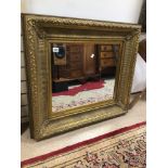 A LARGE GILDED FRAMED MIRROR, 92 X 83CM