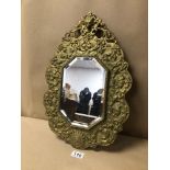AN UNUSUAL GILDED HEAVY MIRROR DECORATED WITH EMBOSSED ANIMALS AROUND AND A FOX HEAD TO THE TOP,