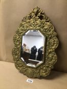 AN UNUSUAL GILDED HEAVY MIRROR DECORATED WITH EMBOSSED ANIMALS AROUND AND A FOX HEAD TO THE TOP,