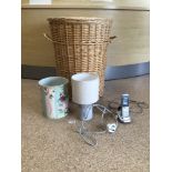 A CANE WORKED LAUNDRY BASKET, WITH LAMP AND BIN