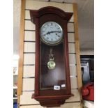 A 31 DAY LINCOLN WALL CLOCK IN A MAHOGANY CASE, 75CM