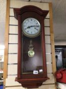 A 31 DAY LINCOLN WALL CLOCK IN A MAHOGANY CASE, 75CM