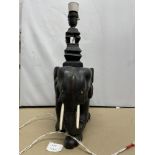 A BLACK EBONISED ELEPHANT LAMP A/F, 43CM