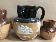 THREE ROYAL DOULTON STONE GLAZED POURING JUGS, THE LARGEST 19CM