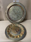 TWO EASTERN BRASS WALL CHARGERS / TRAYS WITH DECORATIVE INLAY, LARGEST BEING 41CM IN DIAMETER