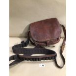 AN ANTIQUE LEATHER GAME KEEPERS BAG WITH SHOT GUN LEATHER BELT