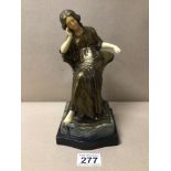 AN ART NOUVEAU GILT METAL AND SIMULATED IVORY FIGURE OF A SEATED WOMAN ON A MARBLE PLINTH, 23CM