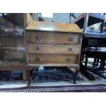 A VINTAGE MAHOGANY BUREAU WITH THREE DRAWER ON CABRIOLE LEGS