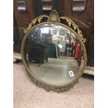 A VINTAGE GILT METAL ROUND MIRROR BEVELLED EDGED, 60CM