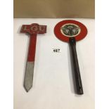 A METAL GERMAN TRAFFIC PADDLE WITH AN EARLY LADIES GOLF UNION TEE MARKER