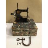 AN ANTIQUE GERMAN MINIATURE SEWING MACHINE