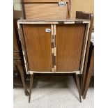 A MID-CENTURY TAMBOUR FRONTED CABINET ON SPLAYED LEGS A/F